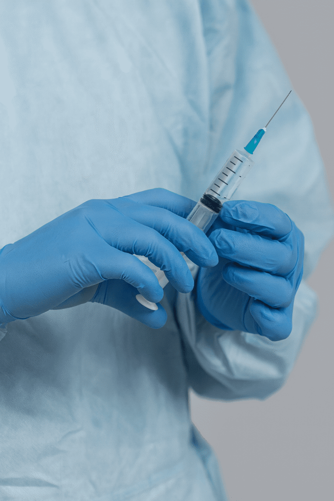 Virta Classic worn by healthcare professional holding a syringe